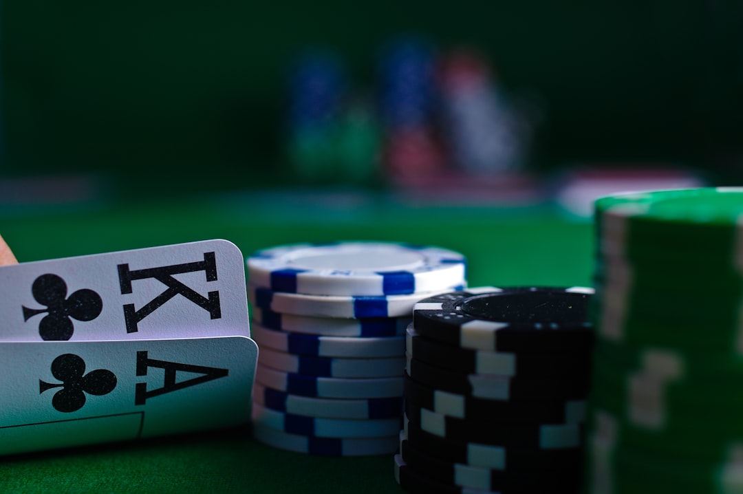 Close-up of Baccarat cards and poker chips on a green felt table